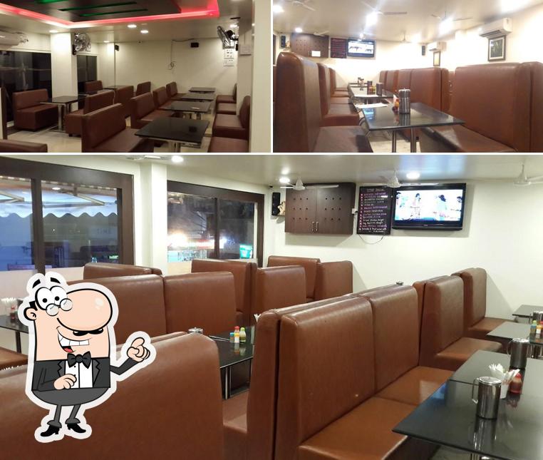 Take a seat at one of the tables at Rasikas Restaurant