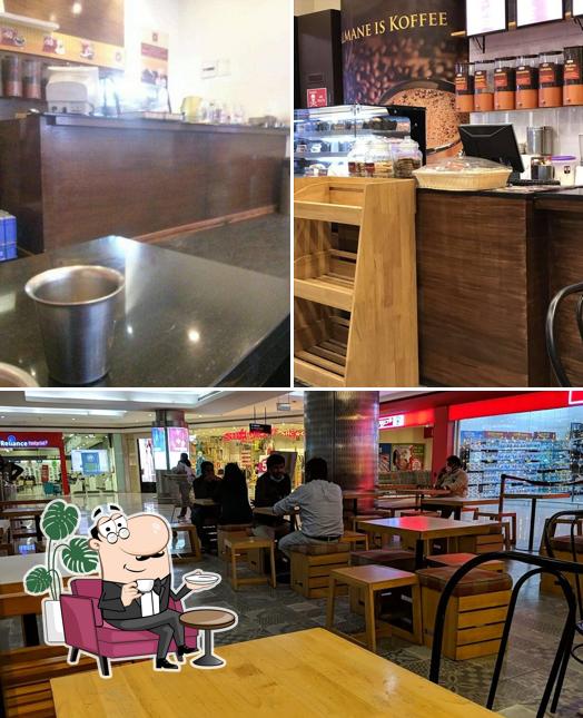 Take a seat at one of the tables at Kalmane Koffees