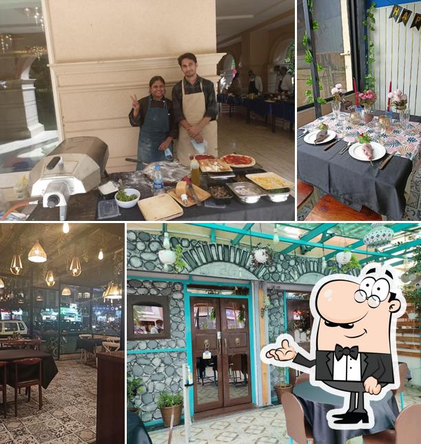 Take a seat at one of the tables at Bella Vita Pizzeria