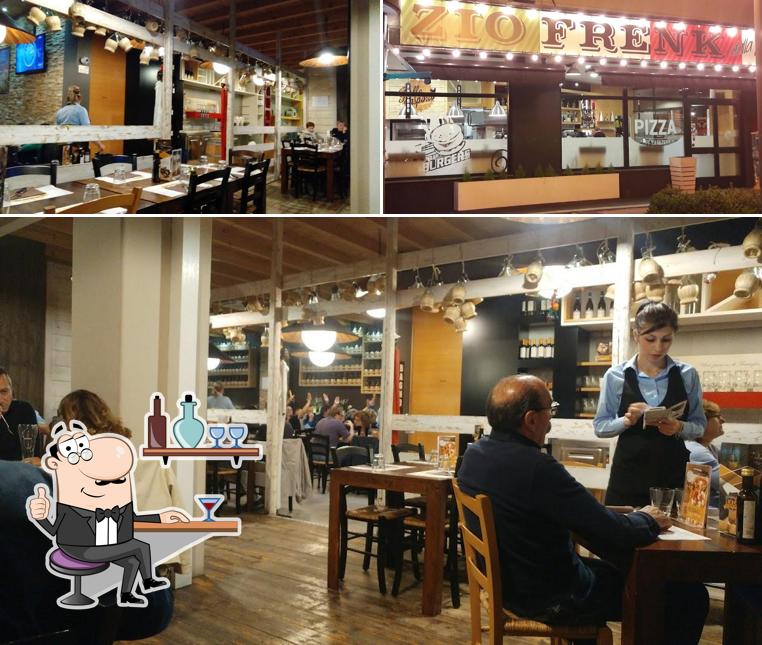 La foto di interni e bancone da bar da Zio Frenk - dalla pizza alla brace