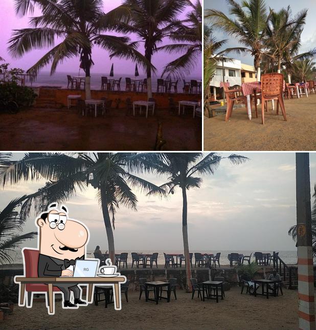 Take a seat at one of the tables at 3rd Rock Brasserie & Restaurant