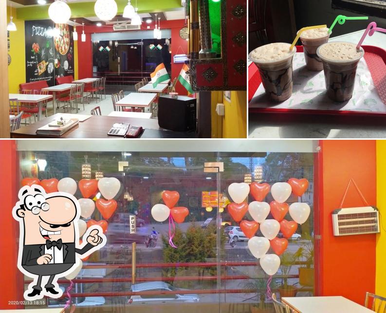 The picture of interior and beverage at Pizza Mannia