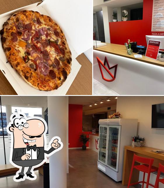 Questa è la foto che presenta la interni e pizza di Regina Margherita - Dosson -