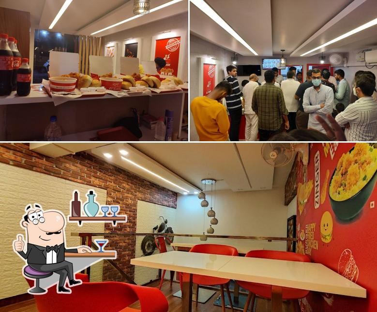 Check out the photo displaying interior and beverage at Al Baik