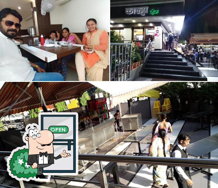 This is the image depicting exterior and dining table at Kanha Veg