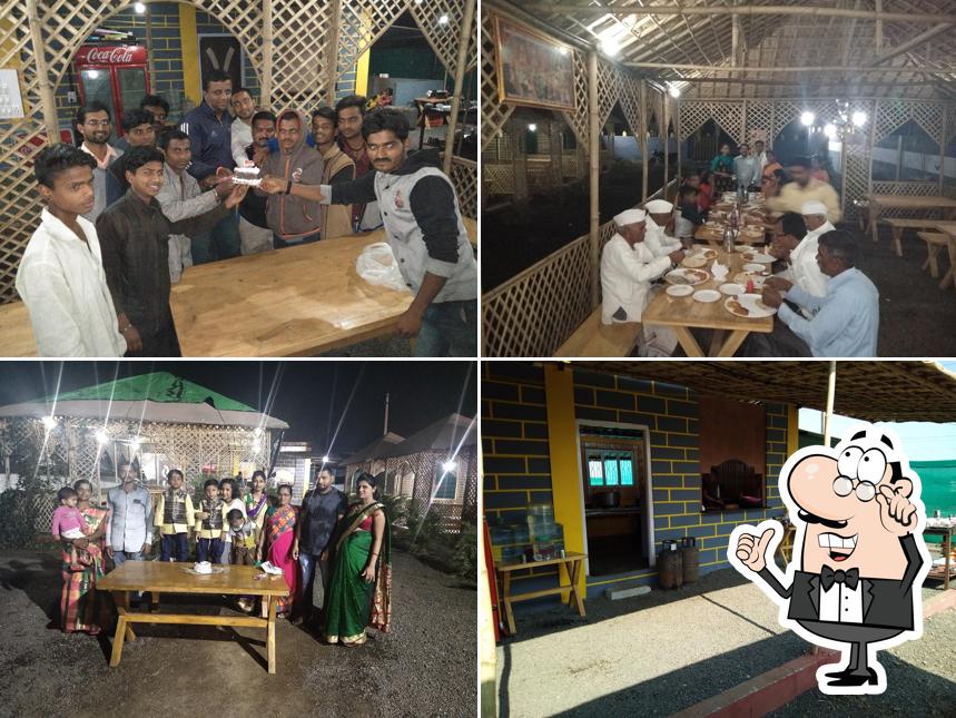 Take a seat at one of the tables at Hotel Malharwada