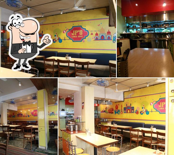 Take a seat at one of the tables at JP's Lunch Home / Mast Malwani n mangalorean coastal