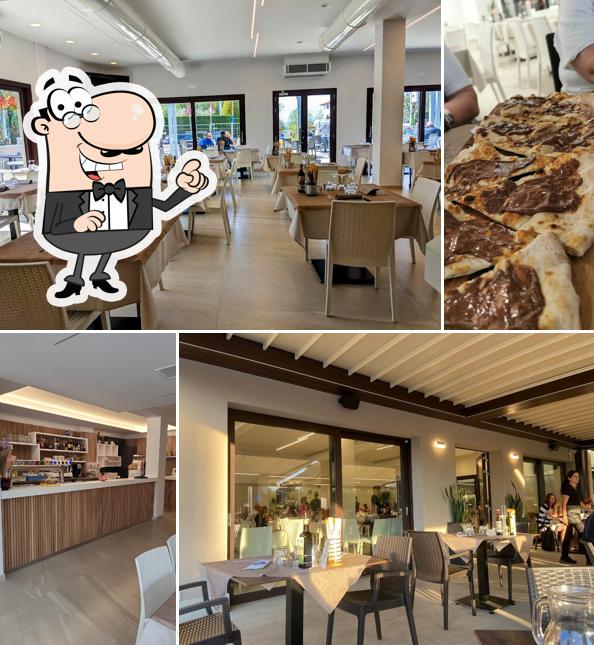 Siediti a un tavolo di Hotel Pizzeria AQUILA