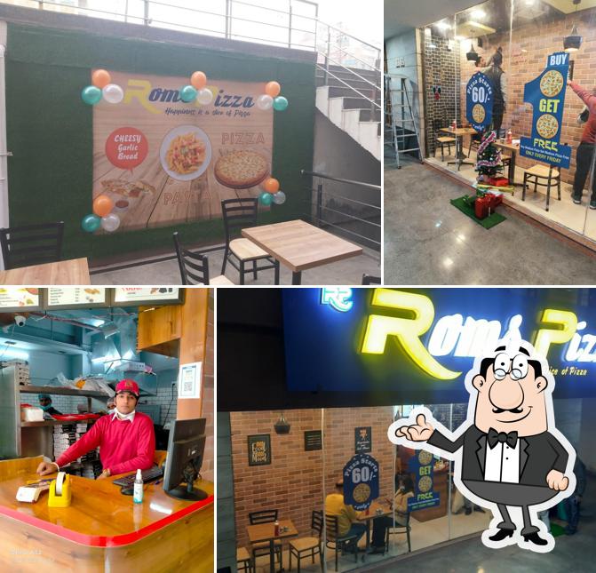 Take a seat at one of the tables at Roms Pizza