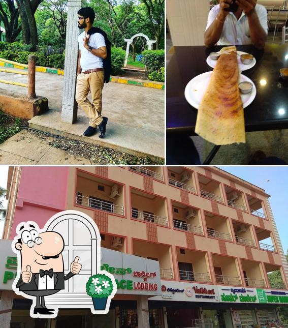 Check out the picture displaying exterior and dining table at Udupi's Vaibhavi Restaurant