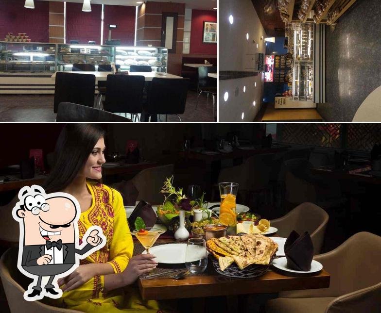 Take a seat at one of the tables at Saffron Sanctuary -From The House Of Ritzz