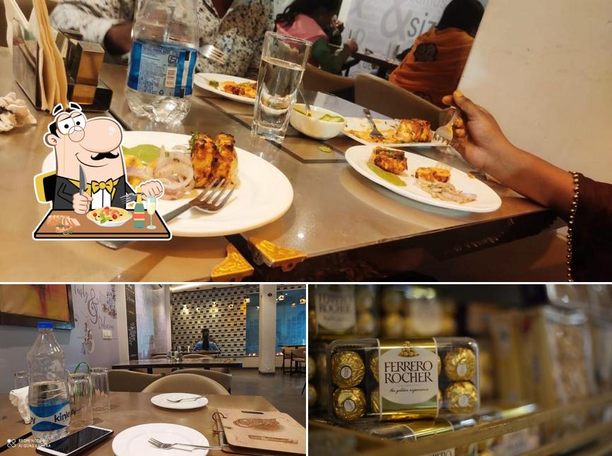 The picture of food and dining table at Anand Bakers - Bakes N Buns