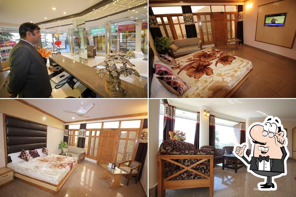 Take a seat at one of the tables at Hotel Asian Plaza - Mcleodganj