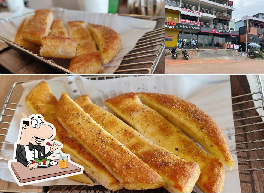 Pizza Hut Seaport Airport Road Kakkanad, Kochi is distinguished by food and exterior