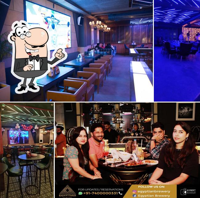 Take a seat at one of the tables at Egyptian Brewery Best bar & Pub In Ranjit avenue Amritsar- Restro Bar in amritsar- best Night Club in Amritsar