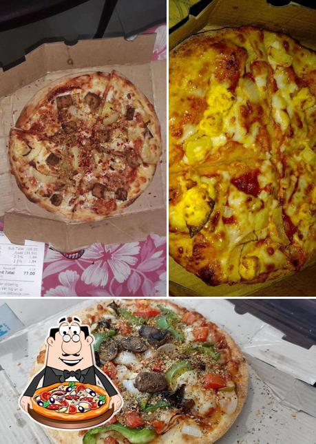 Try out pizza at Rominus Pizza And Burger