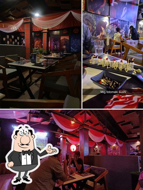 Take a seat at one of the tables at Uchiha Restaurant Mysuru