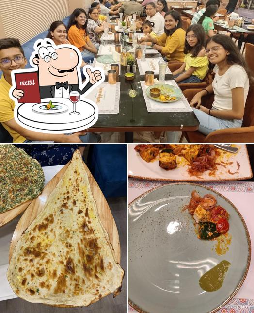 Among various things one can find food and dining table at Kake Di Hatti - Since 1942 (Bhawanipur) Pure Veg