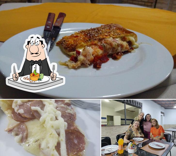 O Pizza Artezanalle se destaca pelo comida e mesa de jantar