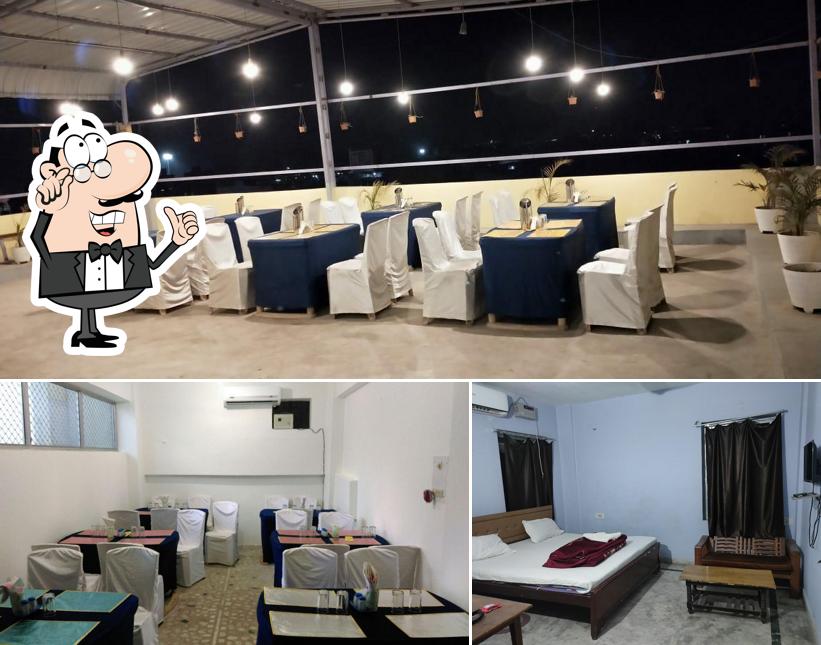 Take a seat at one of the tables at Hotel Piyush