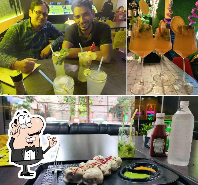 Check out the photo showing interior and beverage at Momo Magic Cafe Bgp