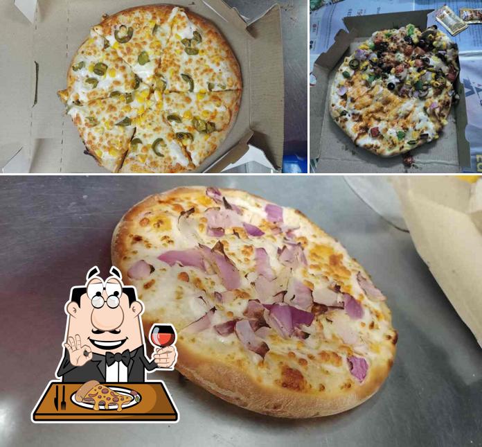 Get pizza at The Pizza Theatre