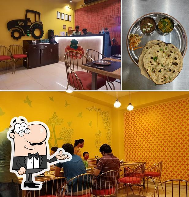 Check out the photo displaying interior and food at Happiness Dhaba