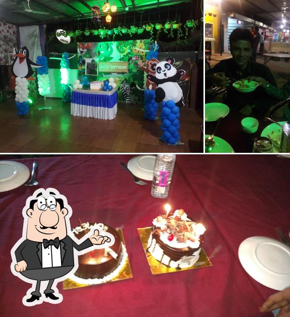 Take a seat at one of the tables at Nikunj Restaurant