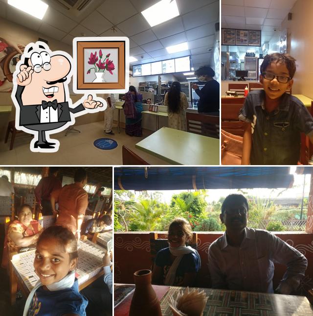 Take a seat at one of the tables at Domino's Pizza Rayanigudem, Nalgonda