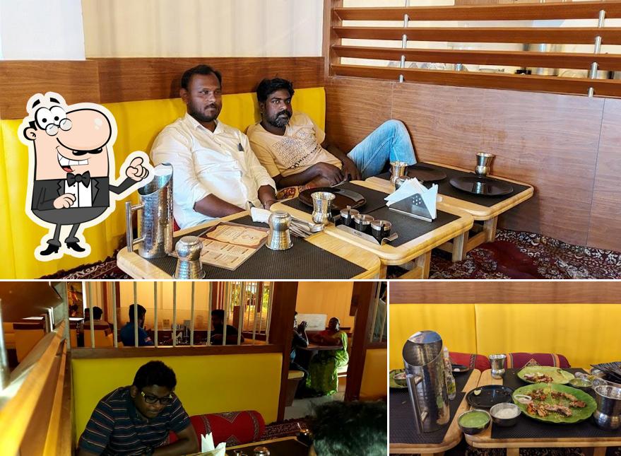 This is the picture displaying interior and dining table at Rayalaseema Spice - Hosur