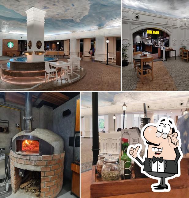 Take a seat at one of the tables at Brik Oven - Neapolitan Style Pizzas (Palace Road)