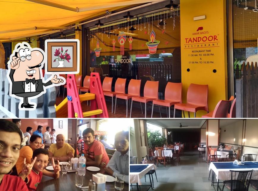 Take a seat at one of the tables at HOTEL TANDOOR