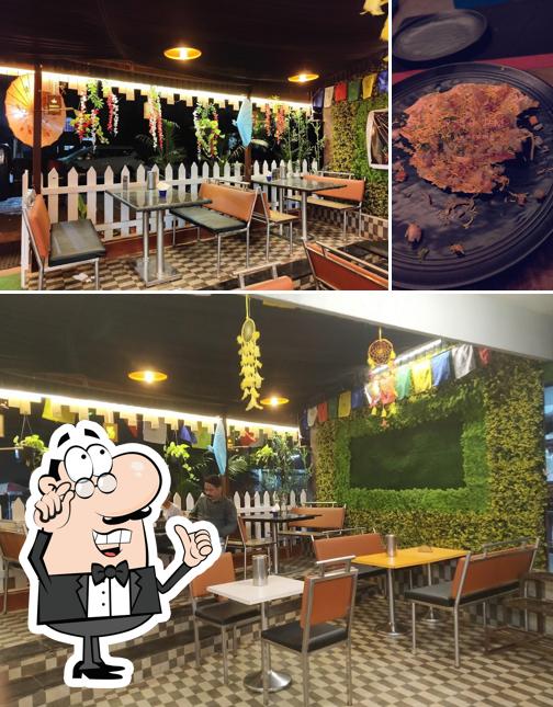 Check out the picture displaying interior and food at SURUCHI PAKWAN