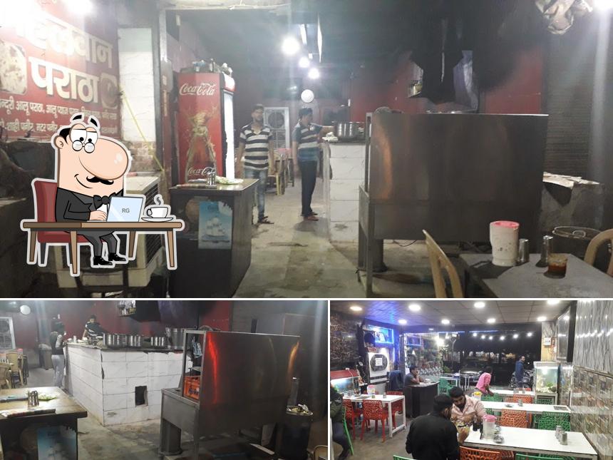 Take a seat at one of the tables at Pahalwan Dhaba (असली )