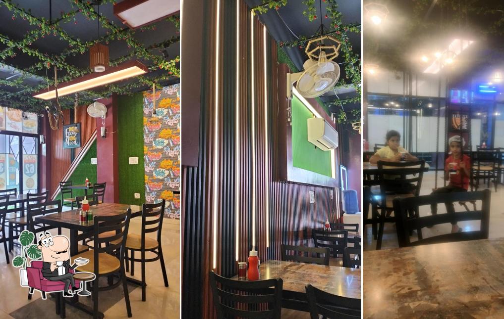 Take a seat at one of the tables at White Hart Pizza