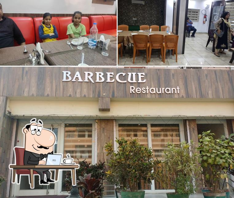 Take a seat at one of the tables at Barbecue Restaurant & Shagun Banquet
