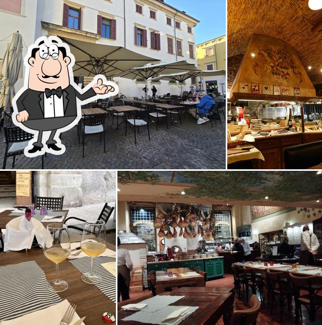 Dai un'occhiata agli interni di Le Cantine De L'arena Ristorante Pizzeria
