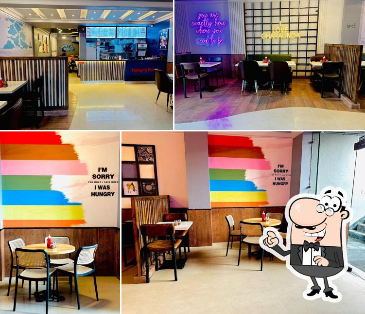 Take a seat at one of the tables at Hungry Point - Gharaunda