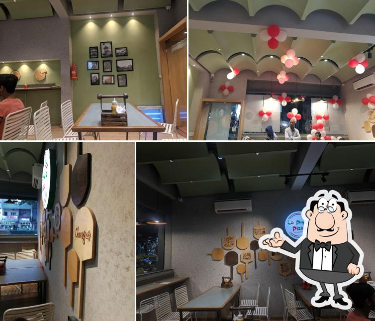 Take a seat at one of the tables at La Pino'z Pizza-Khokhra, Ahmedabad