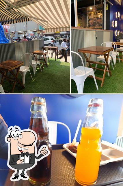 Take a look at the photo displaying interior and alcohol at Sadak Chaap