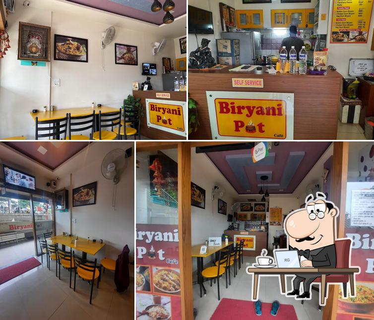 Take a seat at one of the tables at Biryani Pot Cafe