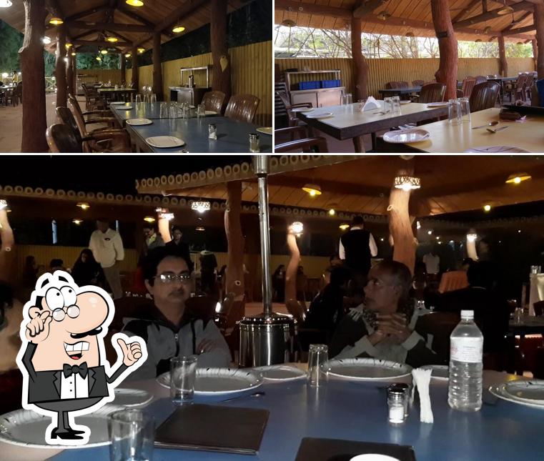 Take a seat at one of the tables at Ishwariya Post Restaurant