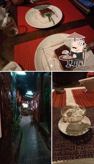 This is the image displaying exterior and dining table at Magic Italy