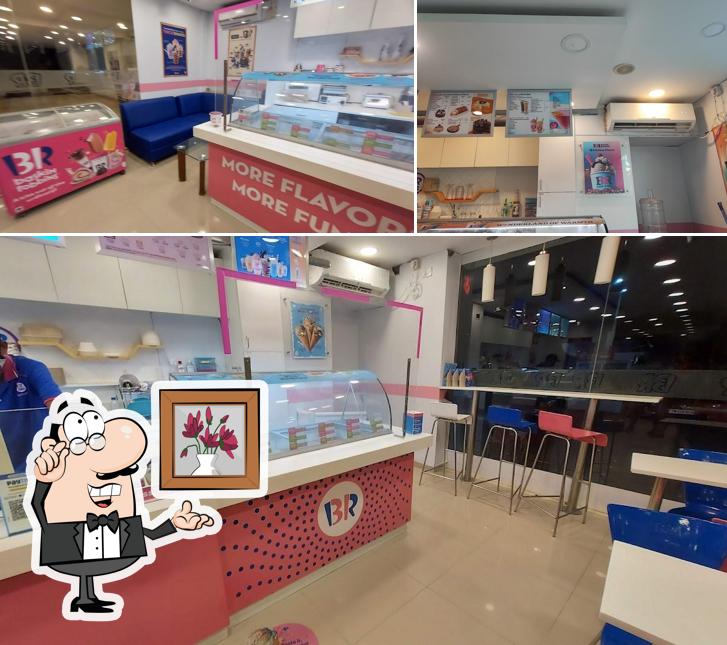 Take a seat at one of the tables at Baskin Robbins