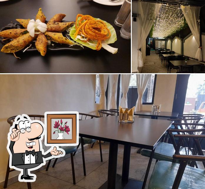 This is the image depicting interior and food at Capital kitchen Restaurant (Pure Veg)