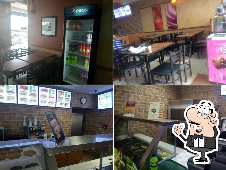 Take a seat at one of the tables at Subway Sector 125 Mohali