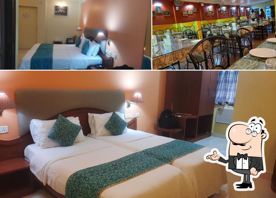 Take a seat at one of the tables at HOTEL BARJORJIS BANJARA - Best Hotel in Balasore