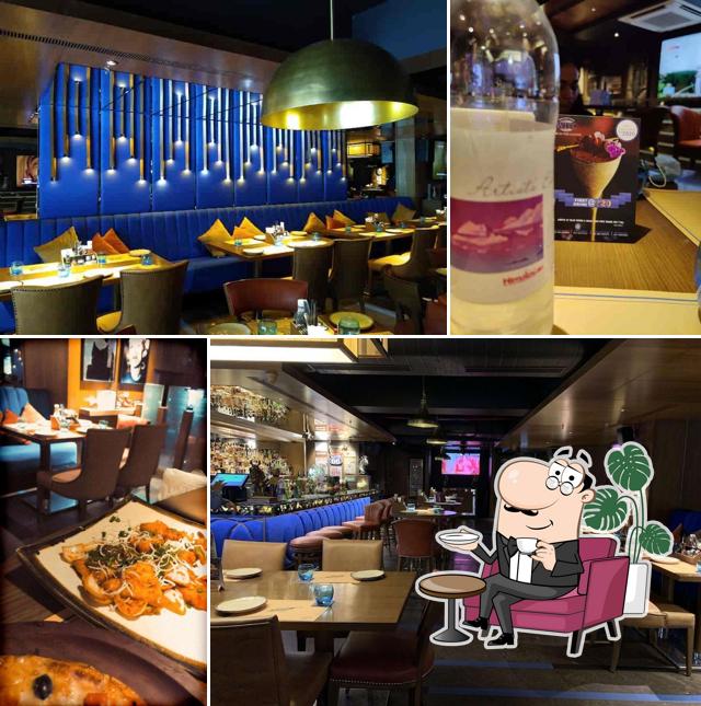 Take a seat at one of the tables at Wok In The Clouds - Connaught Place (CP)