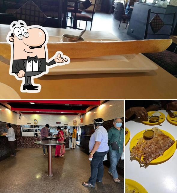 Take a seat at one of the tables at Sri Sairam Parlour