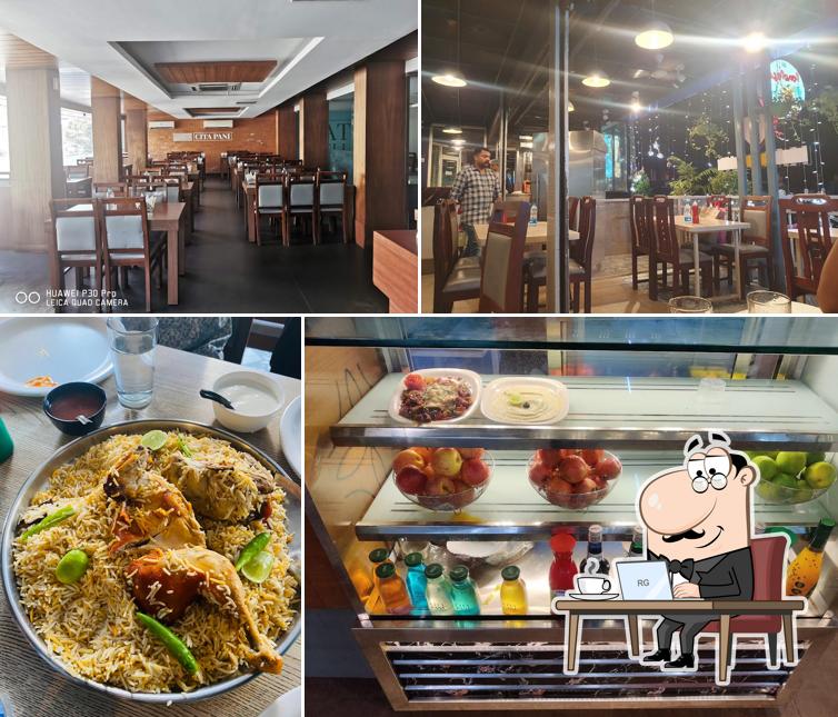 Take a seat at one of the tables at CitaPani Restaurant - Kannur